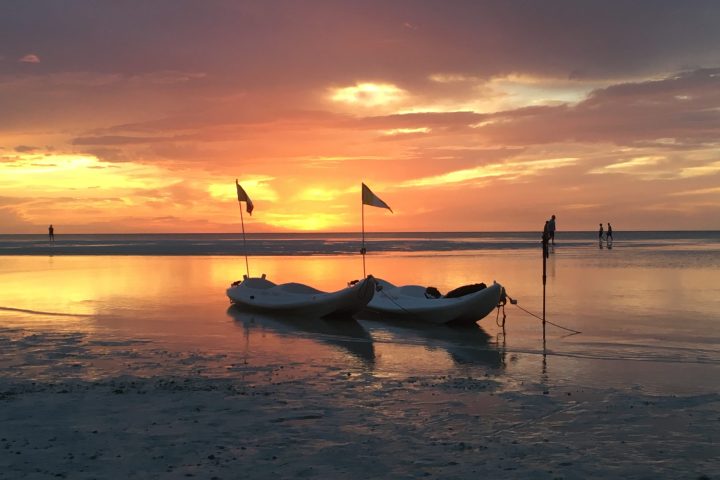 a sunset over a body of water